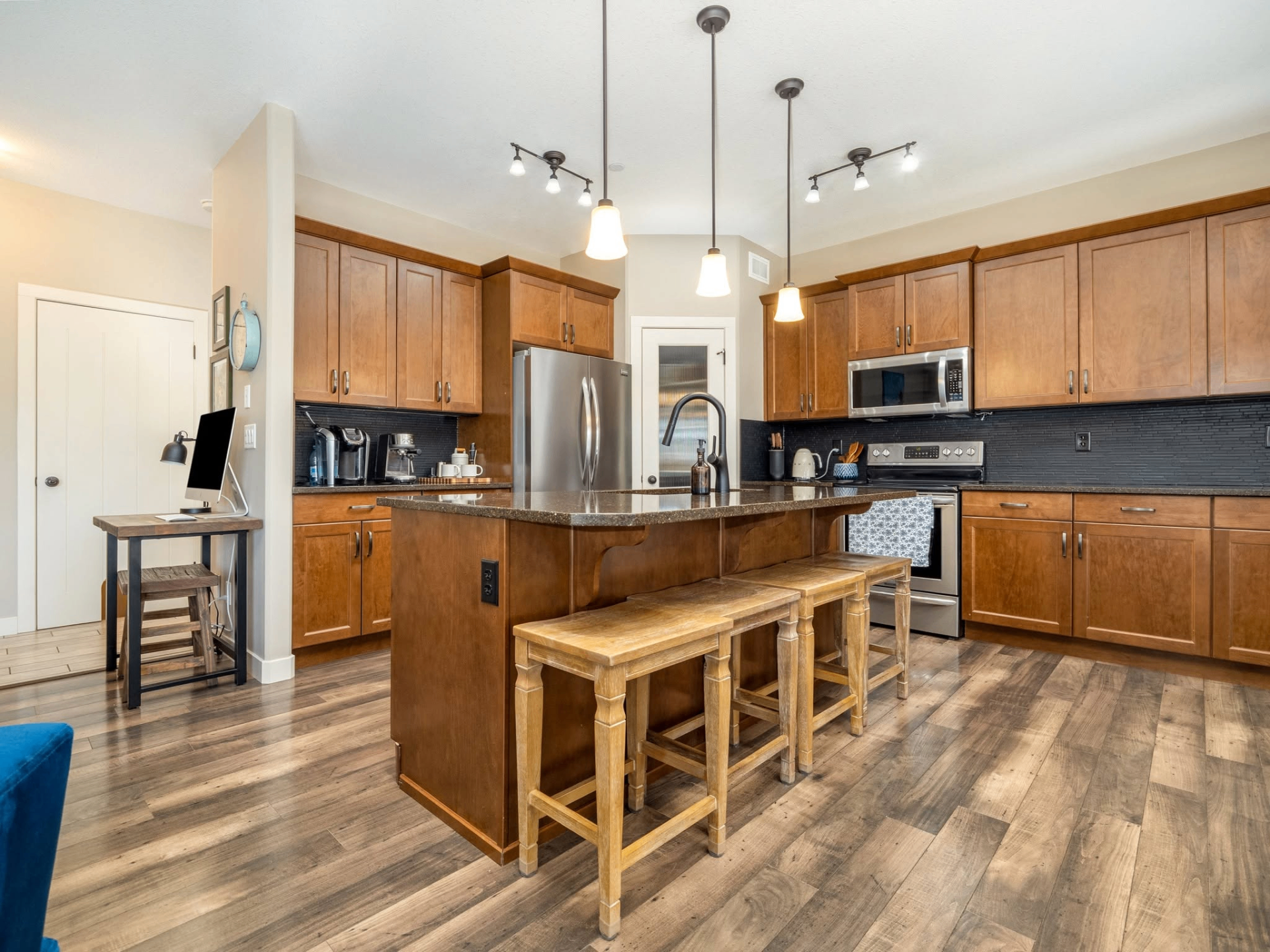 Warm open concept kitchen with island and bar seating